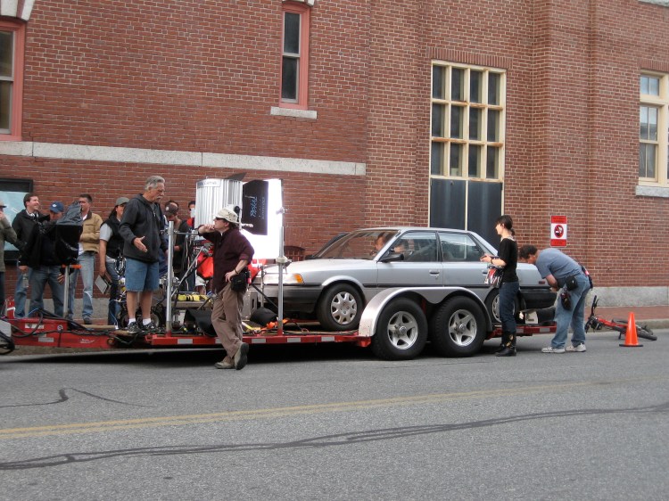 TSOT director and star Ricky Gervais sits inside this car waiting for his queue TSOT director and star Ricky Gervais sits inside this car waiting for his queue